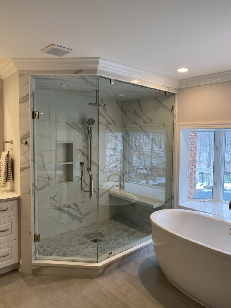 Frameless glass shower enclosure